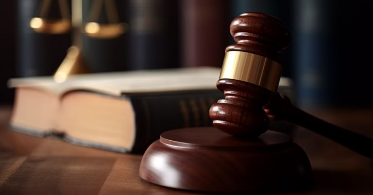 A wooden judge gavel resting on top of a calendar, symbolizing the legal time limits and deadlines to file a lawsuit in a Malaysian court.